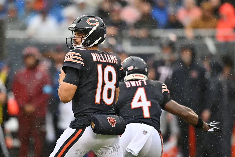 Chicago Bears quarterback dropping back to pass on a rainy game day at Soldier Field